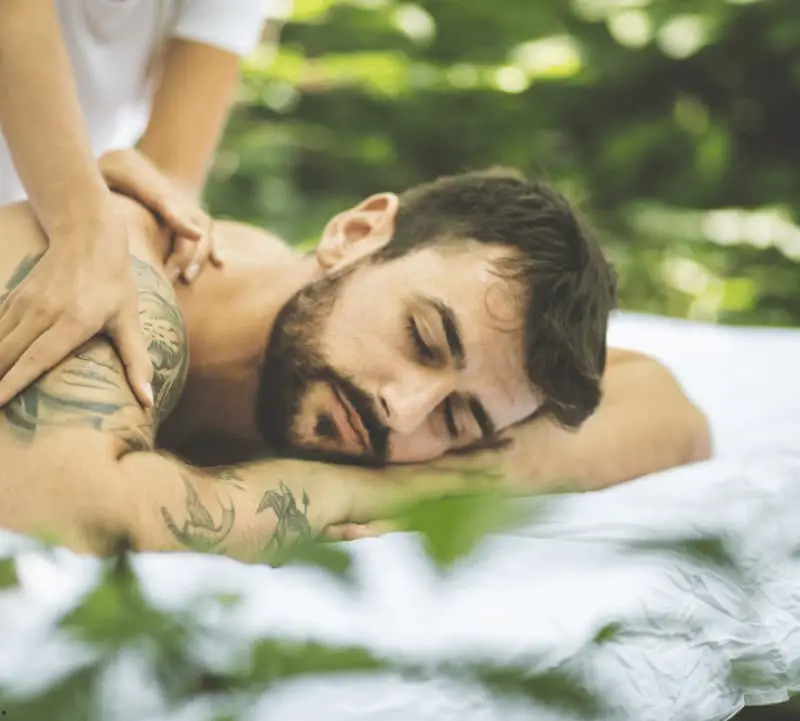 A man getting a Massage from Hitadeha Wellness. Premium Massage Service in Gurugram by Hitadeha Wellness Therapist. Call 9211053153 to book a session.